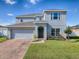 Two-story house with brick driveway at 911 Avenal, Davenport, FL 33837