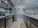 Modern kitchen with stainless steel appliances and dark cabinets at 911 Avenal, Davenport, FL 33837