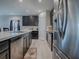 Modern kitchen with stainless steel appliances and dark cabinetry at 911 Avenal, Davenport, FL 33837