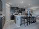 Kitchen island with seating and stainless steel appliances at 911 Avenal, Davenport, FL 33837