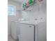 Bright laundry room with Samsung washer and dryer at 911 Avenal, Davenport, FL 33837
