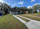 House exterior with double driveway and yard at 934 Golden Rule S Ct, Lakeland, FL 33803