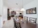 Bright kitchen features dark wood cabinets, ample counter space, and modern appliances at 941 Rimini Dr, St Cloud, FL 34771