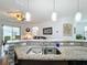 Kitchen island with granite countertops and double sink at 941 Rimini Dr, St Cloud, FL 34771