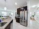 Modern kitchen features stainless steel appliances and granite countertops at 941 Rimini Dr, St Cloud, FL 34771