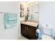 Clean bathroom with dark vanity and granite countertop at 941 Rimini Dr, St Cloud, FL 34771