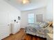 Bedroom with a twin bed, dresser, and wood floors at 941 Rimini Dr, St Cloud, FL 34771