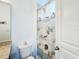 Small bathroom with shower, toilet, and vanity at 941 Rimini Dr, St Cloud, FL 34771