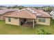 Large backyard with patio, solar panels, and grassy area at 941 Rimini Dr, St Cloud, FL 34771