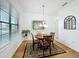 Charming dining room with hardwood floors and a decorative chandelier at 941 Rimini Dr, St Cloud, FL 34771