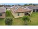 Aerial view of house with solar panels on roof at 941 Rimini Dr, St Cloud, FL 34771