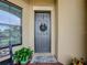 Inviting front door entryway with a charming wreath at 941 Rimini Dr, St Cloud, FL 34771