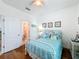 Light and airy bedroom with a full-size bed and en-suite bathroom at 941 Rimini Dr, St Cloud, FL 34771