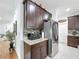 Modern kitchen with dark cabinetry and granite countertops at 941 Rimini Dr, St Cloud, FL 34771