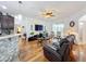 Spacious living room with hardwood floors and a leather couch at 941 Rimini Dr, St Cloud, FL 34771