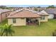 Home with solar panels and patio at 941 Rimini Dr, St Cloud, FL 34771