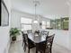 Dining room with dark wood table and six chairs at 941 Rimini Dr, St Cloud, FL 34771