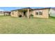Large backyard with a patio and plenty of green space at 941 Rimini Dr, St Cloud, FL 34771