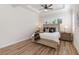 Bright bedroom with a king-size bed and hardwood floors at 10159 Royal Island Ct, Orlando, FL 32836
