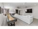 Game room boasts shuffleboard, seating, wet bar, and TV at 10159 Royal Island Ct, Orlando, FL 32836
