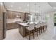 Modern kitchen with gray cabinets, white counters, and an island at 10159 Royal Island Ct, Orlando, FL 32836