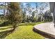 Landscaped backyard with paver patio and lush greenery at 10159 Royal Island Ct, Orlando, FL 32836