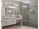 Bathroom with a walk-in shower and double vanity at 10159 Royal Island Ct, Orlando, FL 32836