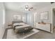 Main bedroom with a king-size bed and modern dresser at 10159 Royal Island Ct, Orlando, FL 32836