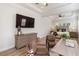 Main bedroom suite with sitting area and large TV at 10159 Royal Island Ct, Orlando, FL 32836