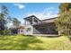 Two-story house with covered patio and screened balcony at 10159 Royal Island Ct, Orlando, FL 32836