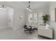 Living area with white couch, window seat, and white walls at 10159 Royal Island Ct, Orlando, FL 32836