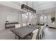 Formal dining room with a large wooden table and chandelier at 10159 Royal Island Ct, Orlando, FL 32836