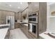 Modern kitchen with stainless steel appliances and ample cabinetry at 10159 Royal Island Ct, Orlando, FL 32836