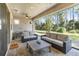 Screened patio with seating area and outdoor furniture at 10159 Royal Island Ct, Orlando, FL 32836
