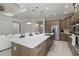 Modern kitchen with gray cabinets, white counters, and an island at 10159 Royal Island Ct, Orlando, FL 32836
