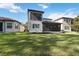 Back exterior view showing home's second story and patio at 10159 Royal Island Ct, Orlando, FL 32836