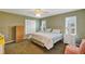 Comfortable bedroom with a king-size bed and dresser at 11447 Sw 69Th Cir, Ocala, FL 34476