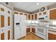 Bright kitchen with white appliances and wood cabinets at 11447 Sw 69Th Cir, Ocala, FL 34476
