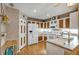 Bright kitchen featuring white appliances and wood cabinets at 11447 Sw 69Th Cir, Ocala, FL 34476