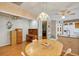Bright dining area with wood table and white chairs at 11447 Sw 69Th Cir, Ocala, FL 34476