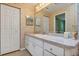 Bathroom features vanity with sink and linen closet at 11447 Sw 69Th Cir, Ocala, FL 34476