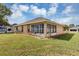 Well-maintained home with a spacious backyard and lush green lawn at 11447 Sw 69Th Cir, Ocala, FL 34476