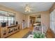 Bright sunroom offering ample natural light, comfortable seating, and access to the backyard at 11447 Sw 69Th Cir, Ocala, FL 34476