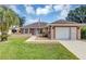Single-story home with stone accents and a two-car garage at 11447 Sw 69Th Cir, Ocala, FL 34476