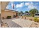 Inviting front patio with brick pavers, landscaping, and American flag at 11447 Sw 69Th Cir, Ocala, FL 34476