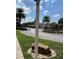 Landscaped entrance to community with circular drive and fountain at 13415 Blue Heron Beach Dr # 106, Orlando, FL 32821