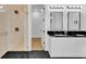 Modern bathroom with double vanity, walk-in shower, and hexagon tile floor at 155 Pearl St, Auburndale, FL 33823