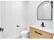 Modern bathroom with a floating vanity and black accents at 155 Pearl St, Auburndale, FL 33823