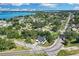 Wide aerial view of the home and surrounding neighborhood near a lake at 155 Pearl St, Auburndale, FL 33823