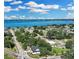 Aerial view of a house near a lake, showing surrounding houses and landscape at 155 Pearl St, Auburndale, FL 33823